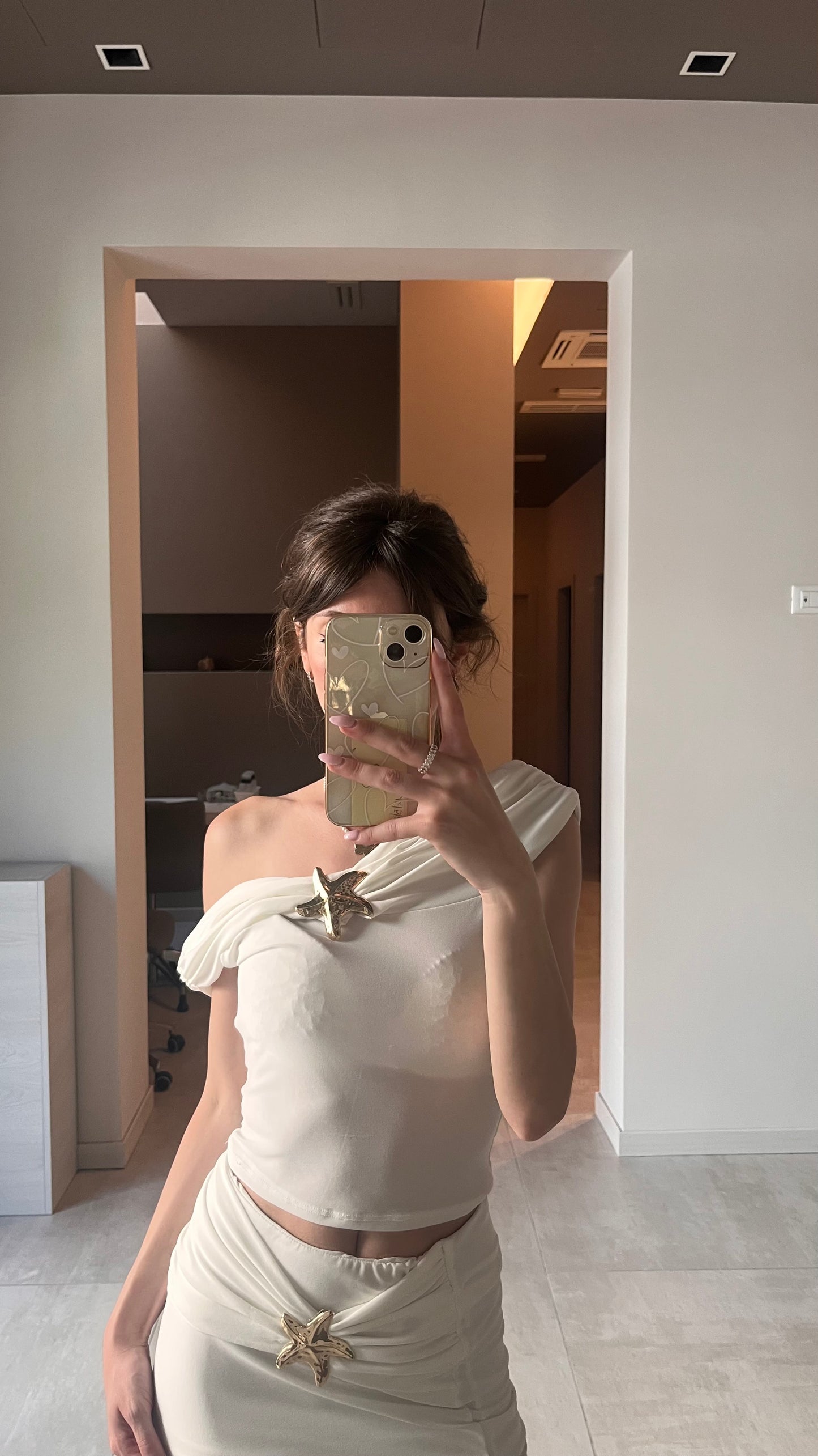Completo bianco con stella marina